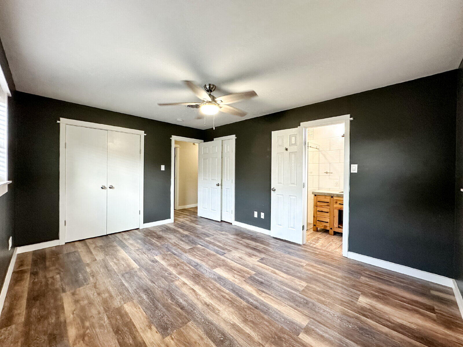 2608 Raleigh Avenue Lubbock, TX 79410 - Photo 11 of 23 a view of an empty room with closet and a bathroom