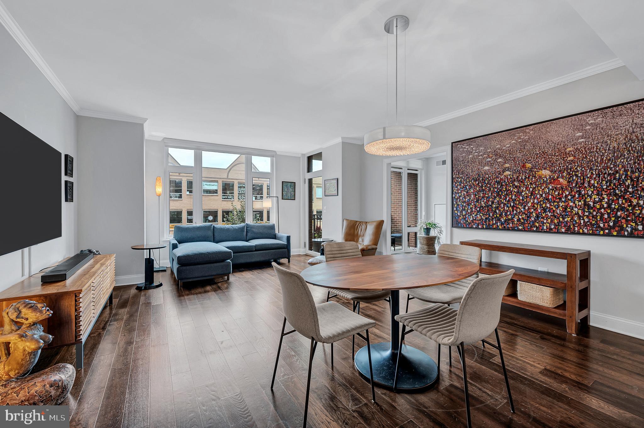 4915 Hampden Lane, Unit 204 Bethesda, MD 20814 - Photo 11 of 31 a view of a dining room with furniture window and wooden floor