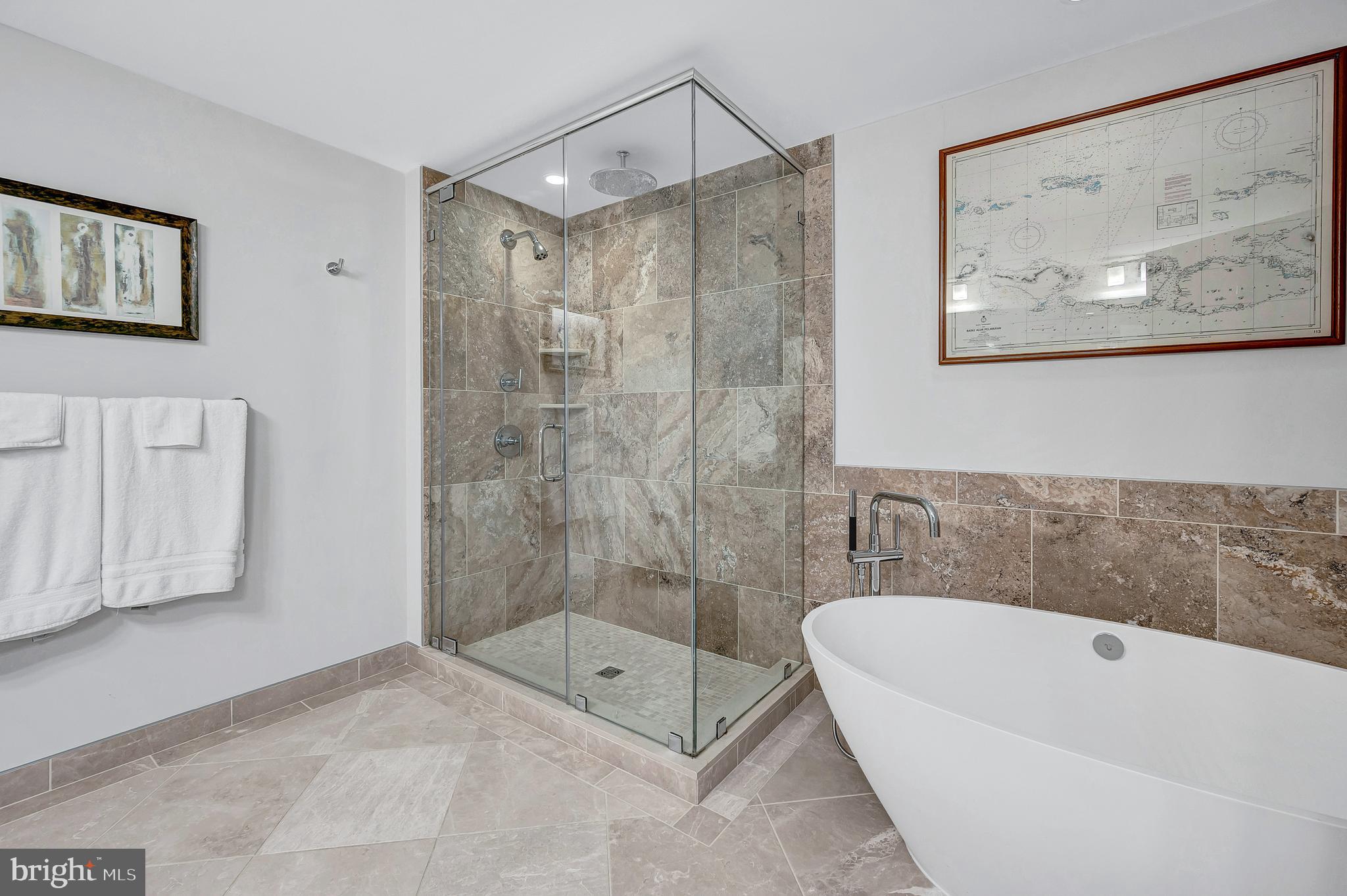 4915 Hampden Lane, Unit 204 Bethesda, MD 20814 - Photo 19 of 31 a bathroom with a bathtub and a shower