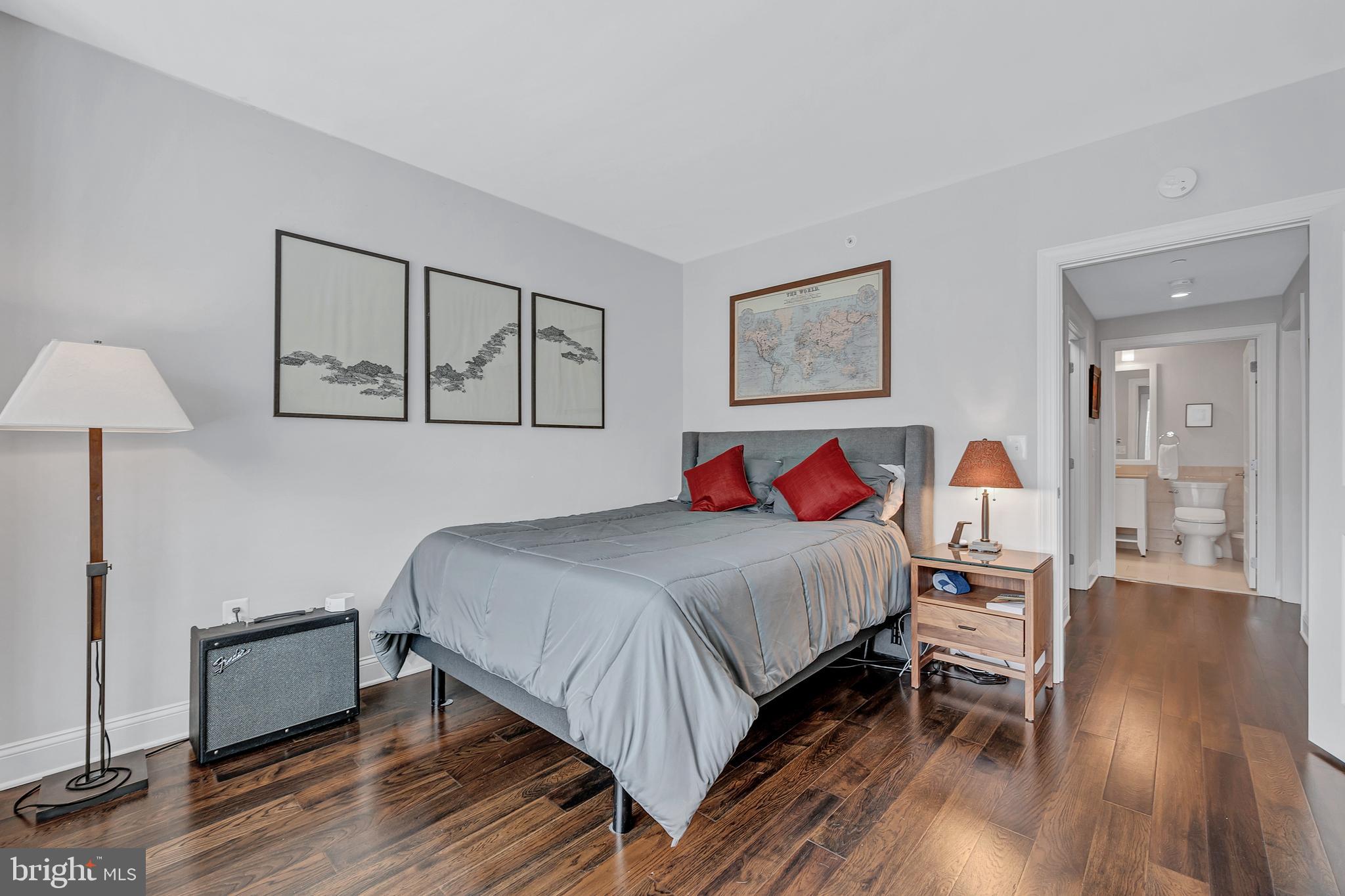 4915 Hampden Lane, Unit 204 Bethesda, MD 20814 - Photo 21 of 31 a bedroom with bed and wooden floor