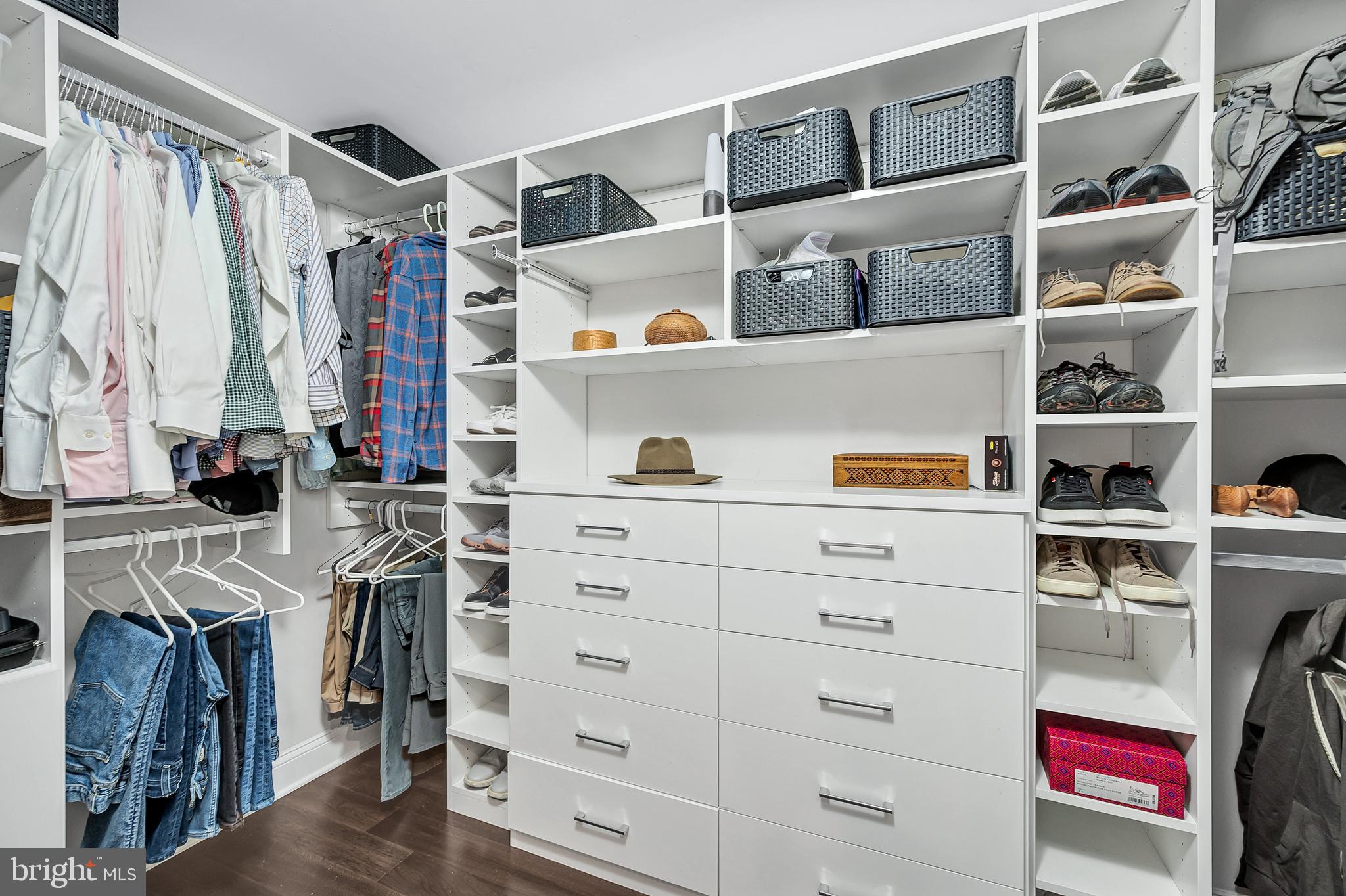 4915 Hampden Lane, Unit 204 Bethesda, MD 20814 - Photo 24 of 31 a view of walk in closet with clothes and shoes