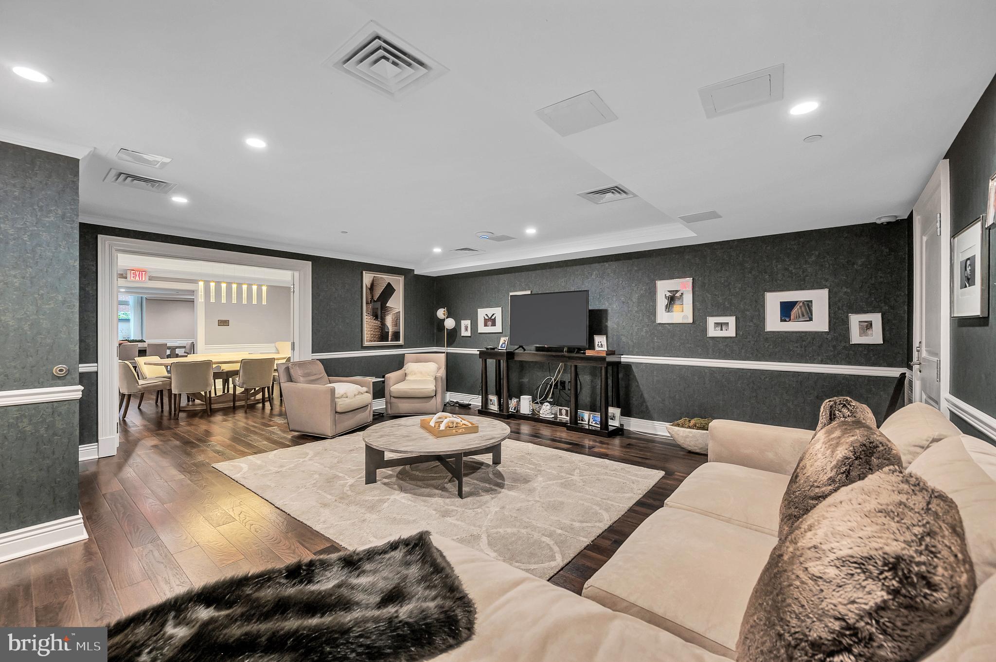 4915 Hampden Lane, Unit 204 Bethesda, MD 20814 - Photo 28 of 31 a living room with furniture and wooden floor