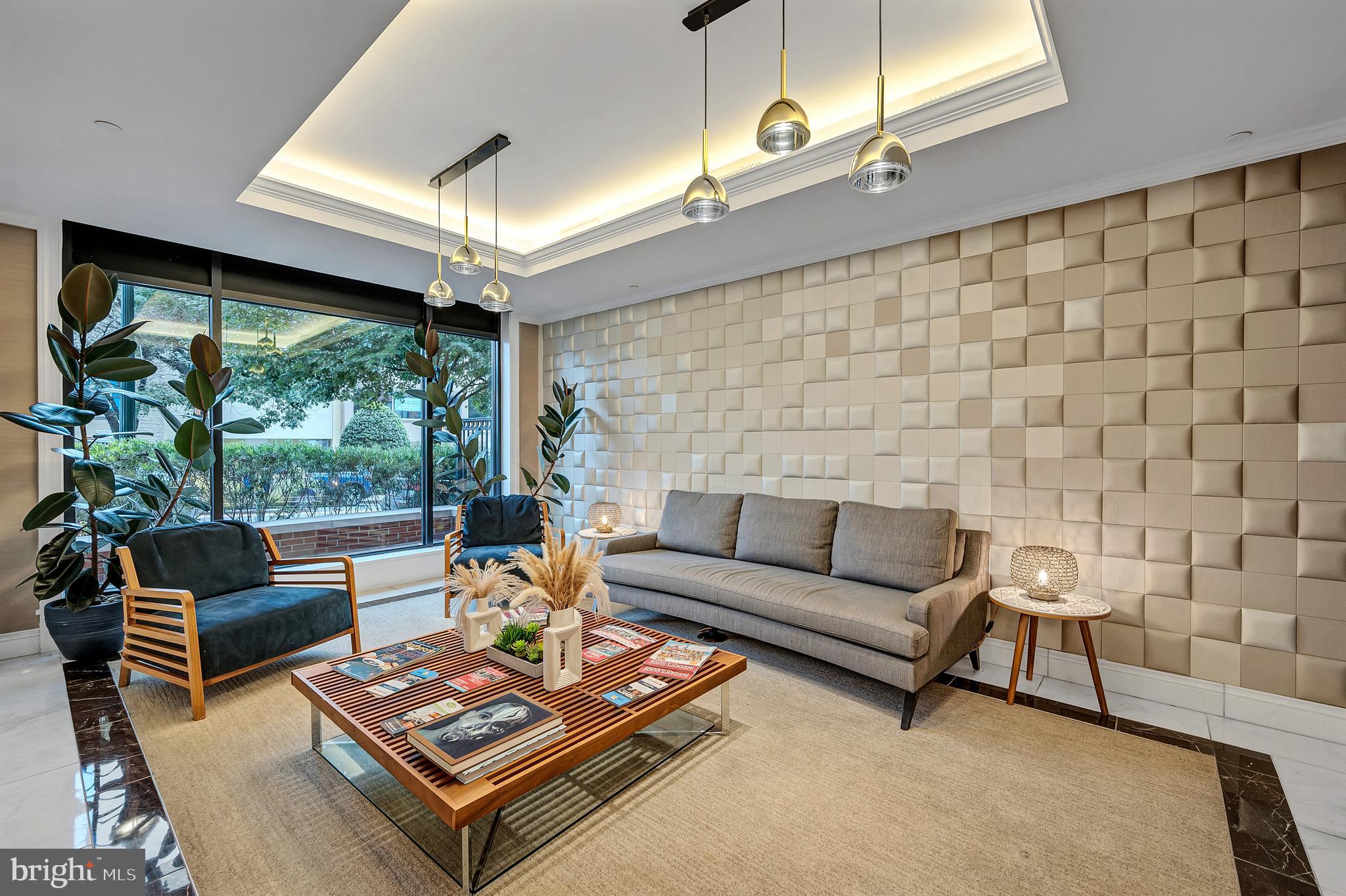 4915 Hampden Lane, Unit 204 Bethesda, MD 20814 - Photo 3 of 31 a living room with furniture and a large window