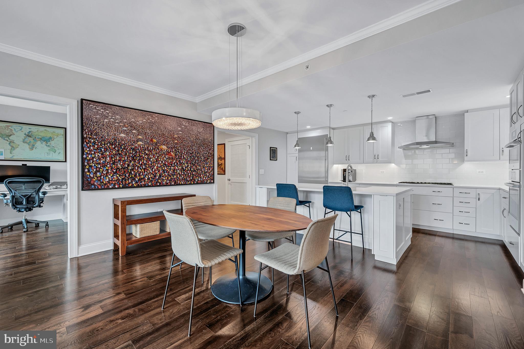 4915 Hampden Lane, Unit 204 Bethesda, MD 20814 - Photo 9 of 31 a view of a dining room with furniture window and wooden floor