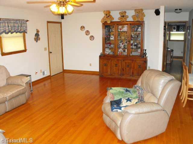 2158 Luffman Road Ronda, NC 28670 - Photo 3 of 12 Living Room. Large Great Room with Oak Floors