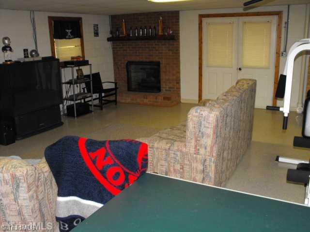 2158 Luffman Road Ronda, NC 28670 - Photo 9 of 12 Den/Family/Great Room. Den with Brick Fireplace