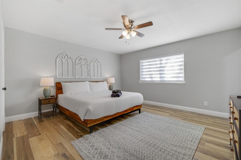 5112 Arbor Glen Road The Colony, TX 75056 - Photo 21 of 40 Bedroom featuring ceiling fan and light wood-type flooring