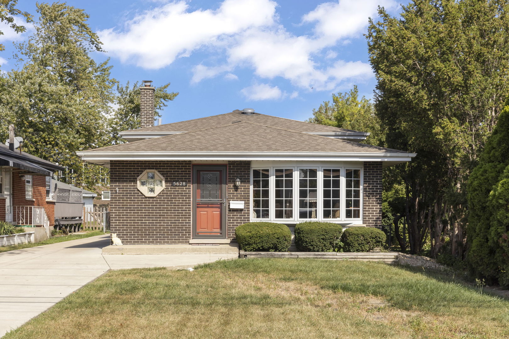 5628 Hawthorne Avenue Berkeley, IL 60163 - Photo 1 of 18 a front view of a house with a yard and garage
