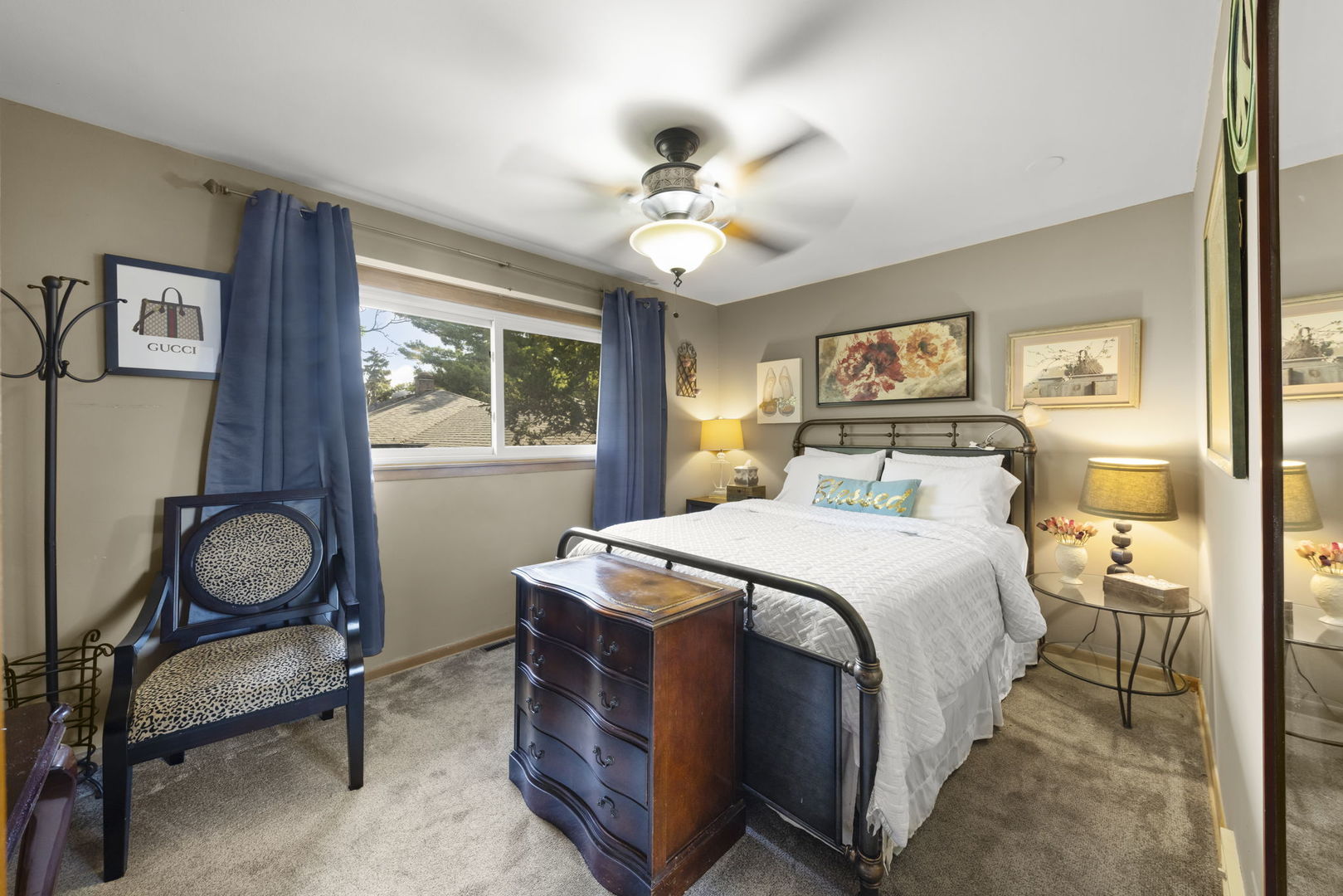 5628 Hawthorne Avenue Berkeley, IL 60163 - Photo 12 of 18 a bedroom with a bed and a chandelier