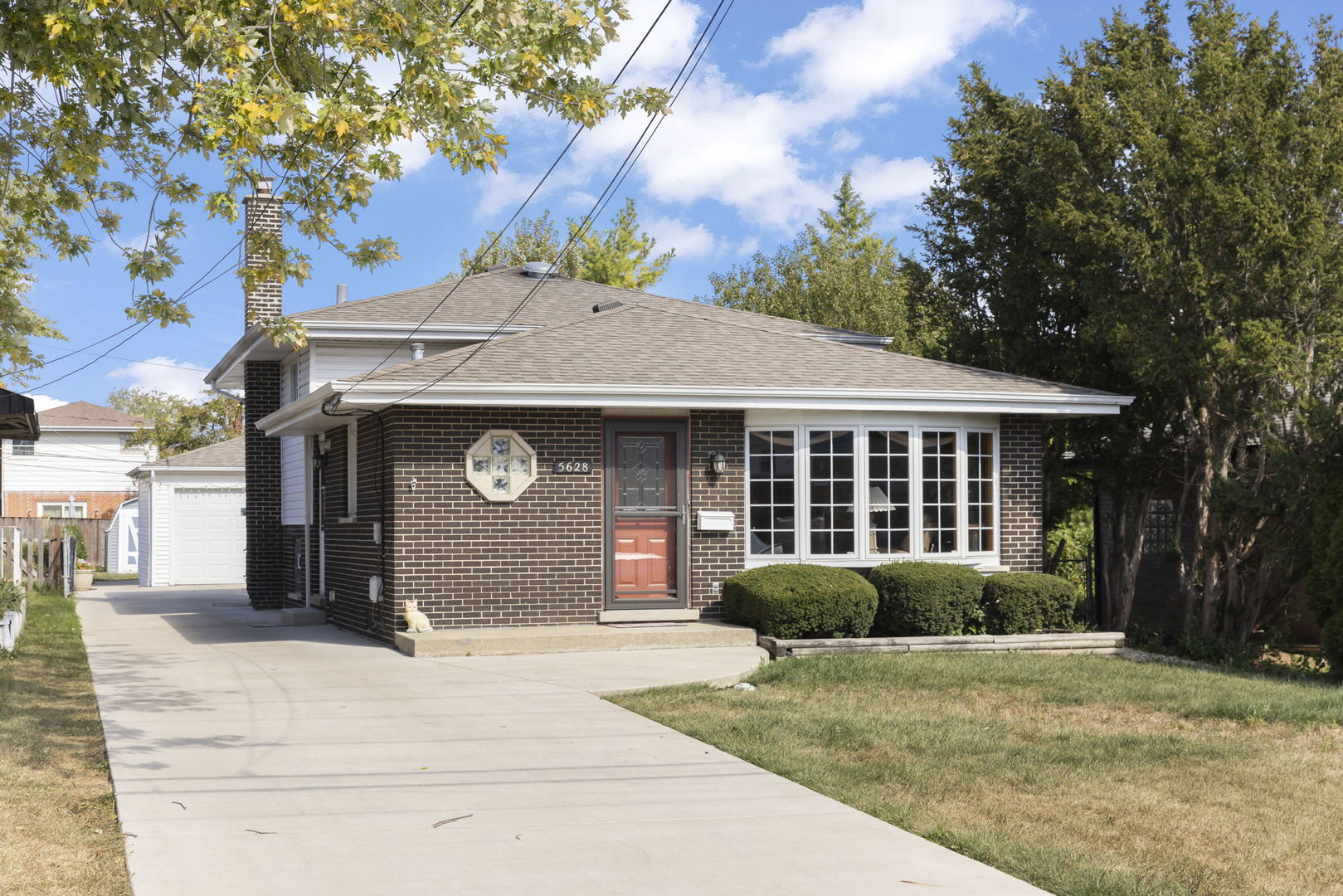 5628 Hawthorne Avenue Berkeley, IL 60163 - Photo 2 of 18 a front view of a house with a yard