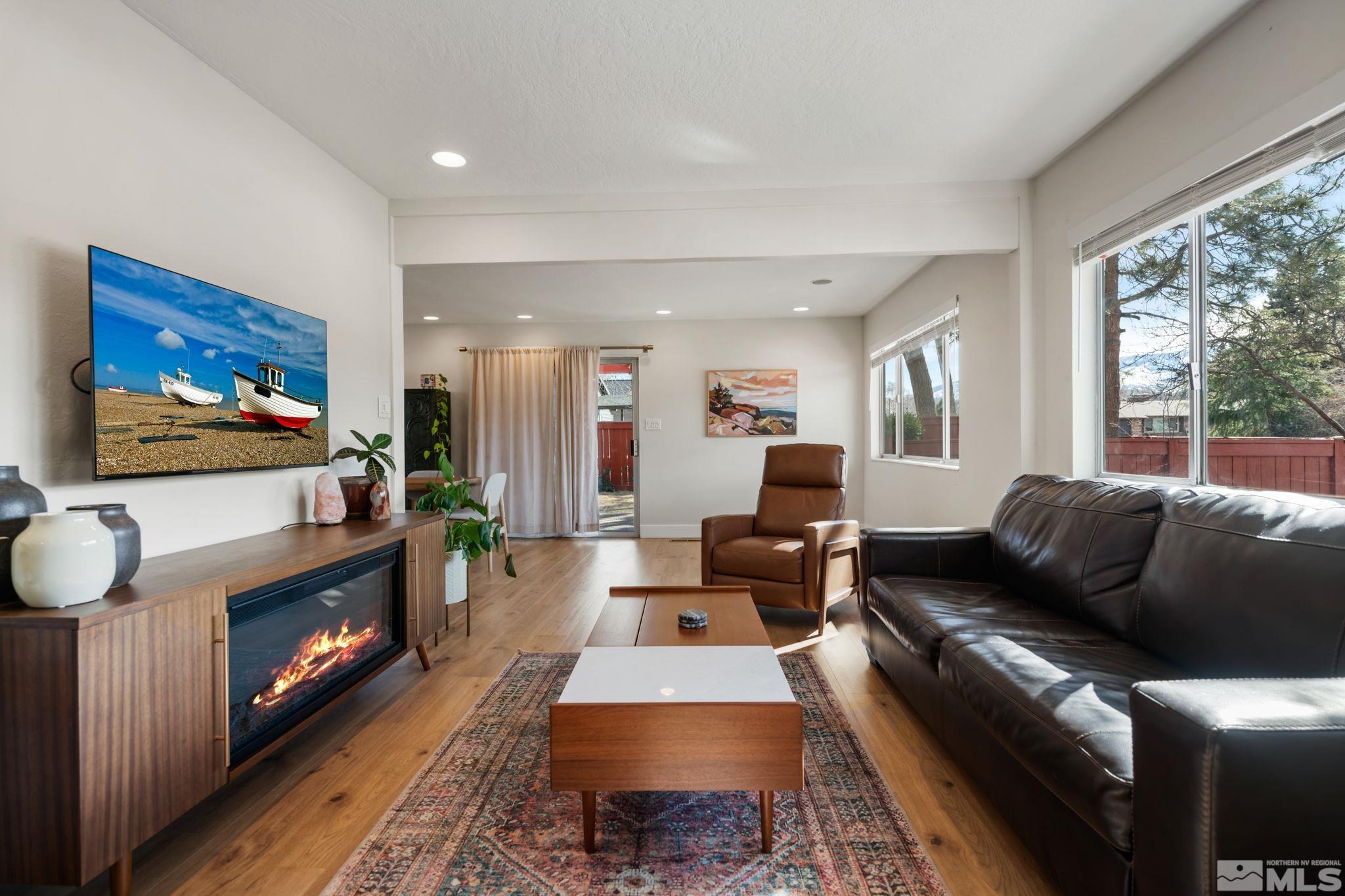 440 Shamrock Lane Reno, NV 89509 - Photo 3 of 34 a living room with furniture and a flat screen tv
