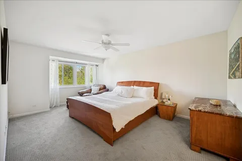 a bedroom with bed and window