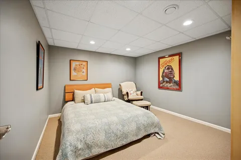 a bedroom with a bed and night stand