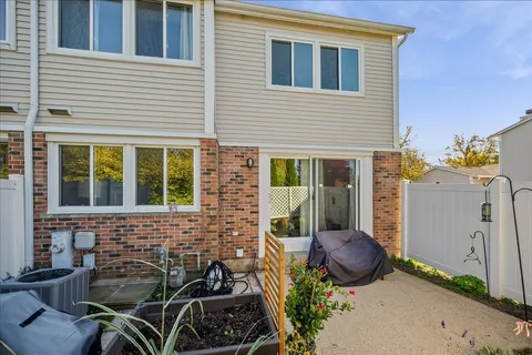 a view of a chair and table in the house