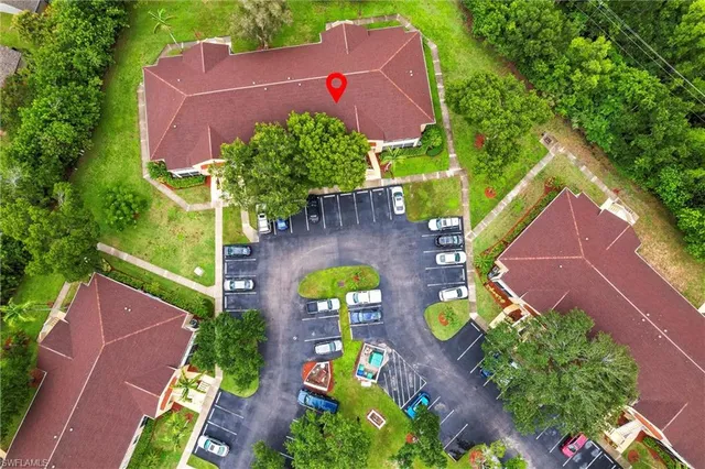 a view of backyard with table and chairs and potted plants