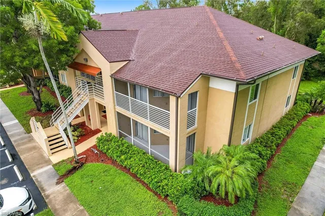 a view of a yard with a table and chairs