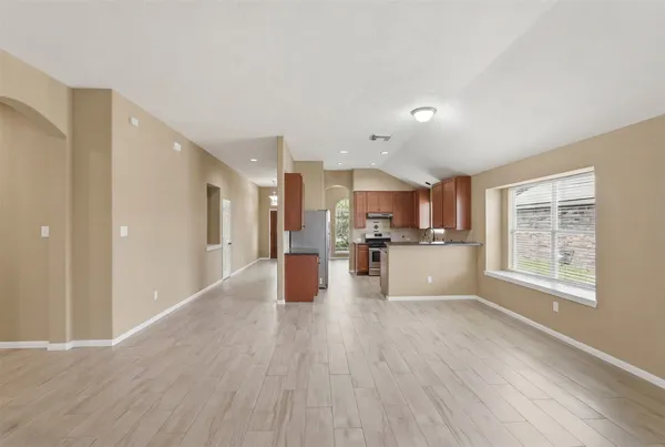 a view of a kitchen with wooden floor