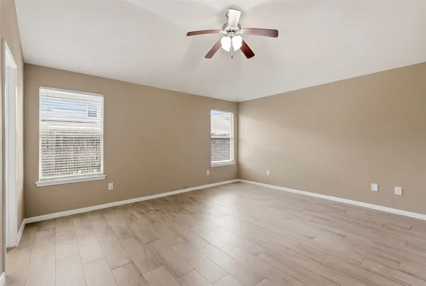 a view of an empty room with a window
