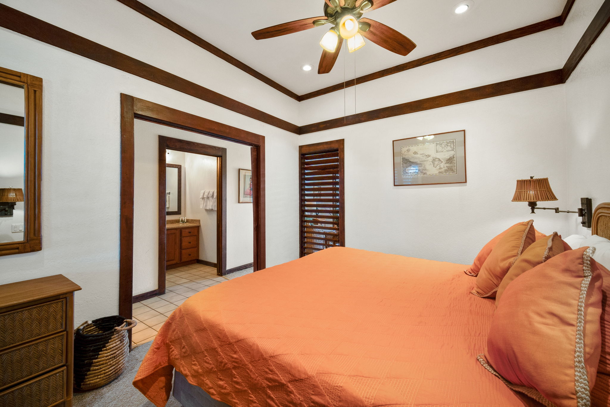 2253 Poipu Road, Unit 101 Koloa, HI 96756 - Photo 12 of 27 a bedroom with a bed and a chandelier
