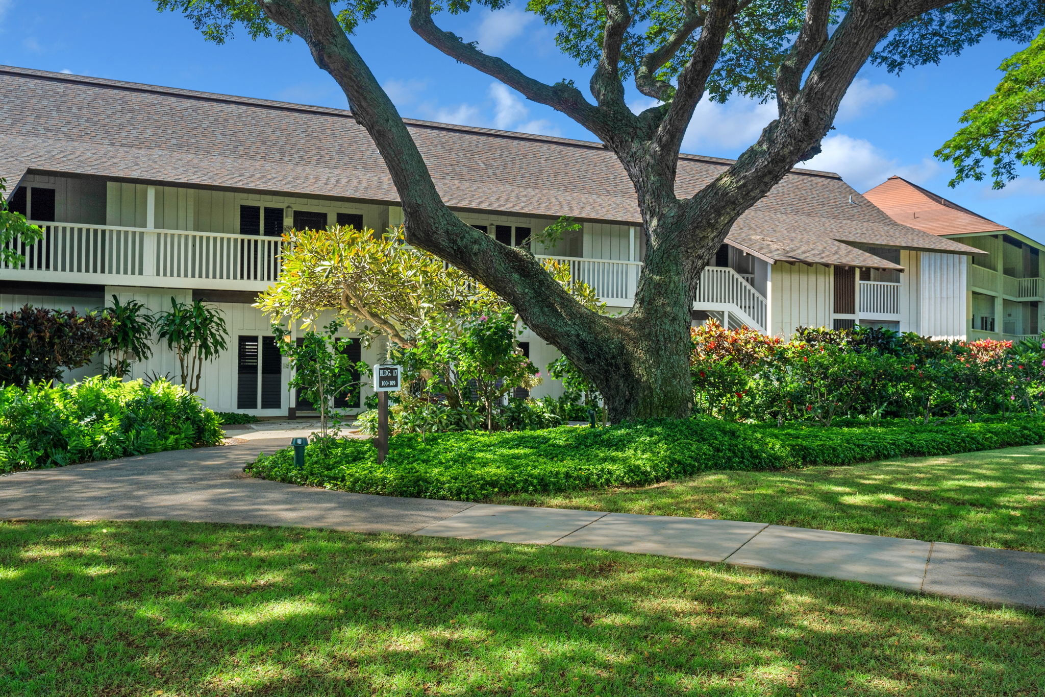 2253 Poipu Road, Unit 101 Koloa, HI 96756 - Photo 15 of 27 a front view of a house with garden