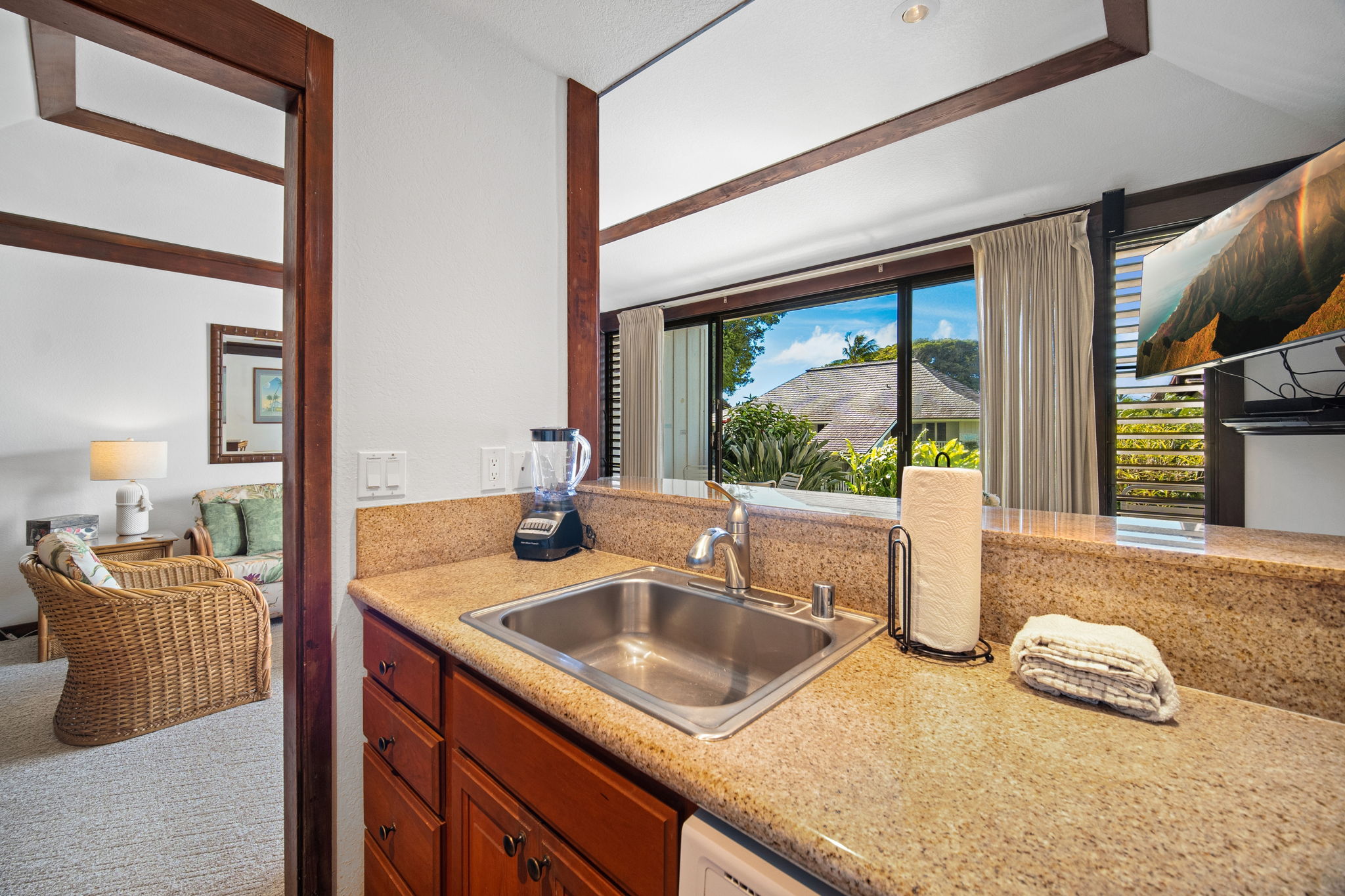 2253 Poipu Road, Unit 101 Koloa, HI 96756 - Photo 10 of 27 a kitchen with a sink and a large window