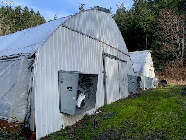 1424 Cavitt Creek Road Glide, OR 97443 - Photo 8 of 16 a house with green field in front of it