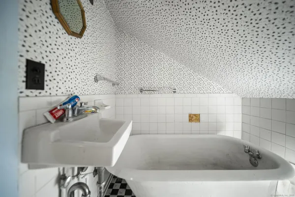 a bathroom with a bath tub