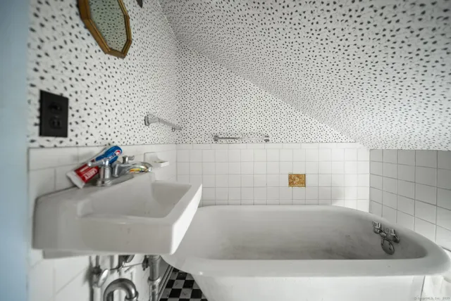 a bathroom with a bath tub