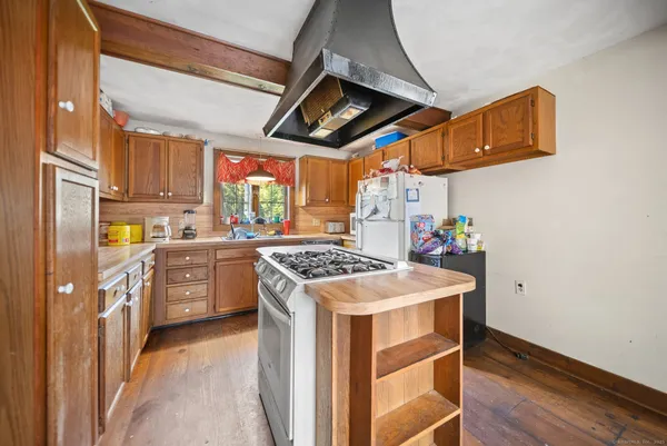 a kitchen with stainless steel appliances granite countertop a stove and a refrigerator