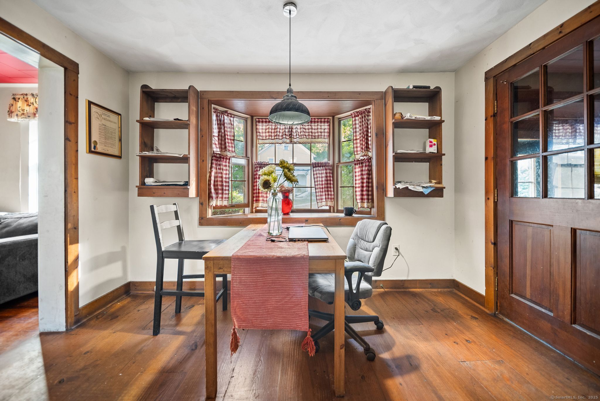 47 8th Street Norwich, CT 06360 - Photo 6 of 16 a view of a dining room with furniture window and wooden floor