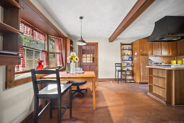 a view of a dining room with furniture window and outside view