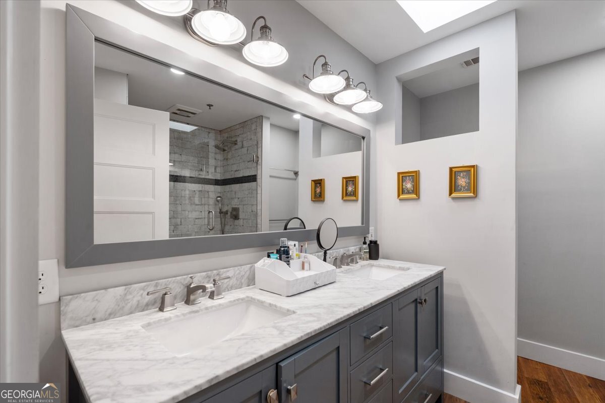 585 White Circle, Unit 402 Athens, GA 30605 - Photo 21 of 44 a bathroom with a granite countertop sink and a mirror