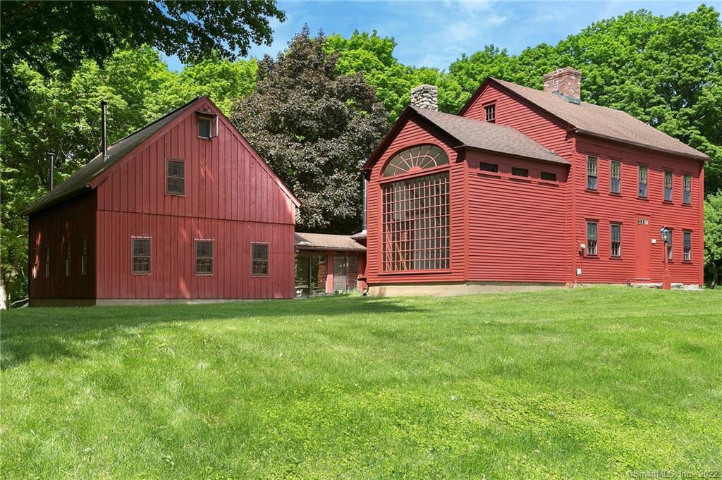 807 Ridgefield Road Wilton, CT 06897 - Photo 1 of 1 a aerial view of a house next to a yard