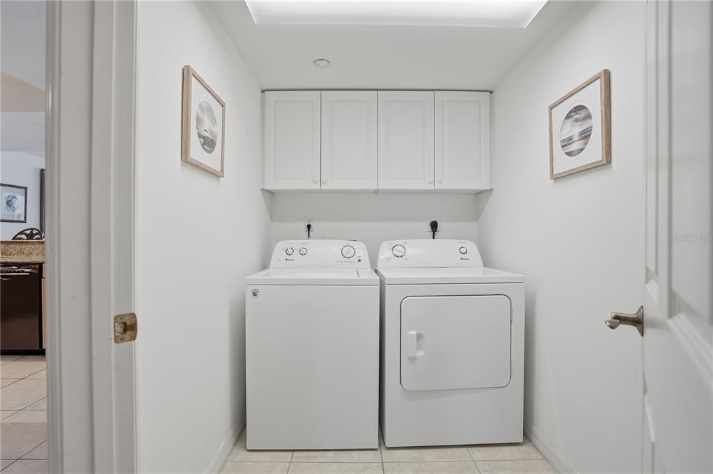 16326 Gulf Boulevard, Unit 307 Redington Beach, FL 33708 - Photo 30 of 43 a utility room with dryer and washer