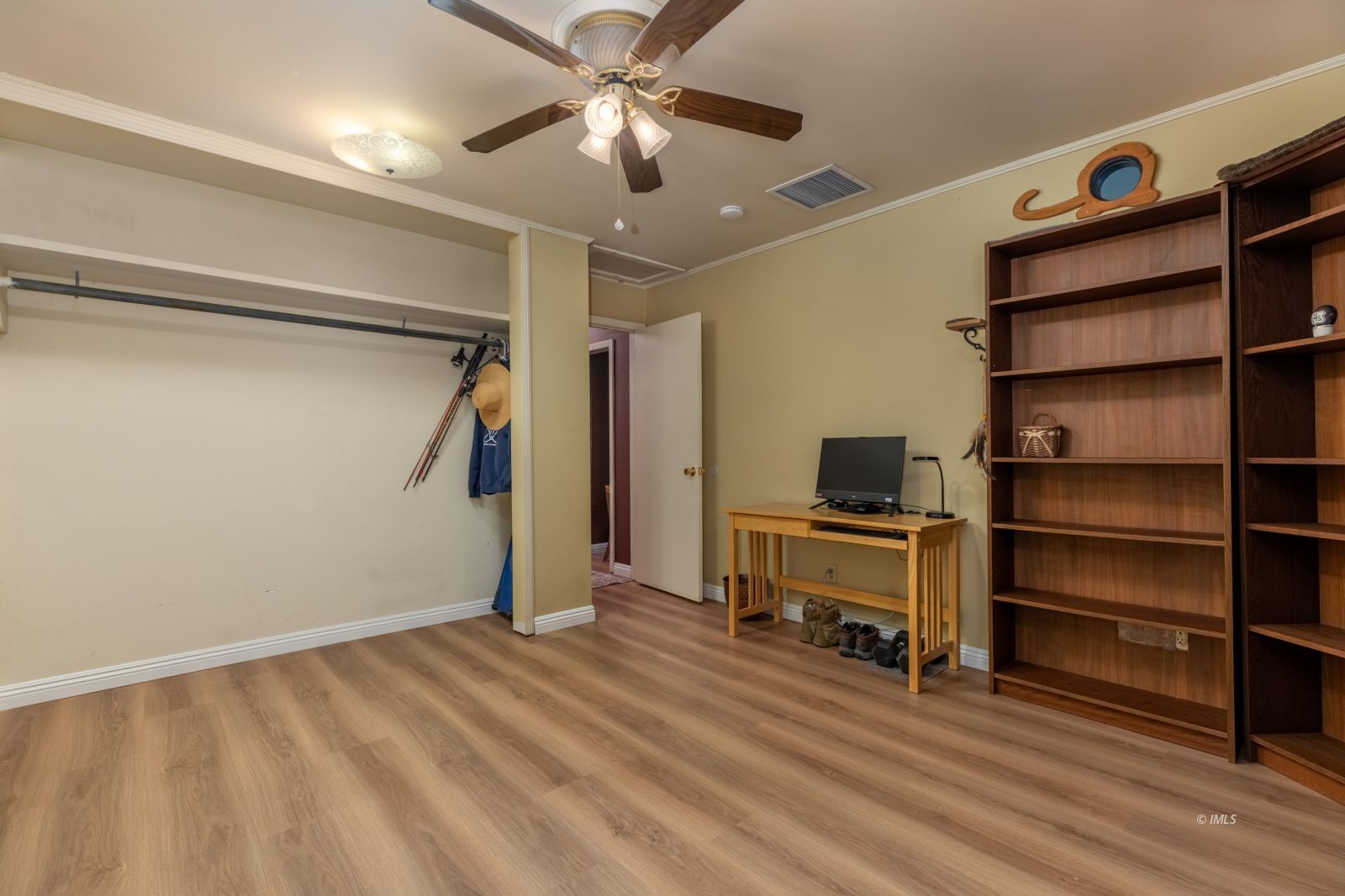 95 Mountain View Avenue Bishop, CA 93514 - Photo 22 of 35 a bedroom with a bed and a ceiling fan