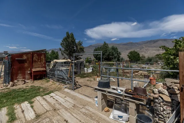 a view of a chairs and table in a patio