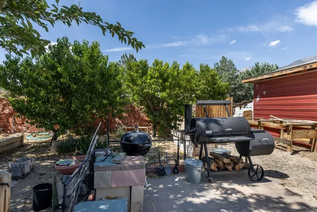 a view of a backyard with sitting area