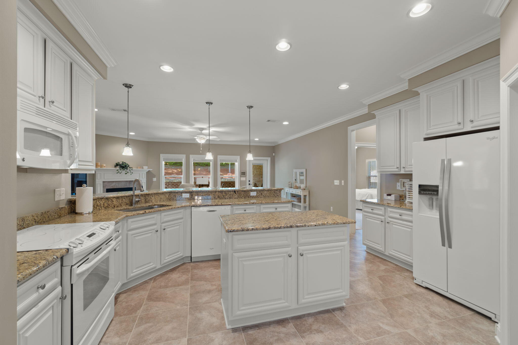 562 Falcon Trail Niceville, FL 32578 - Photo 11 of 40 a kitchen with white cabinets stainless steel appliances and sink