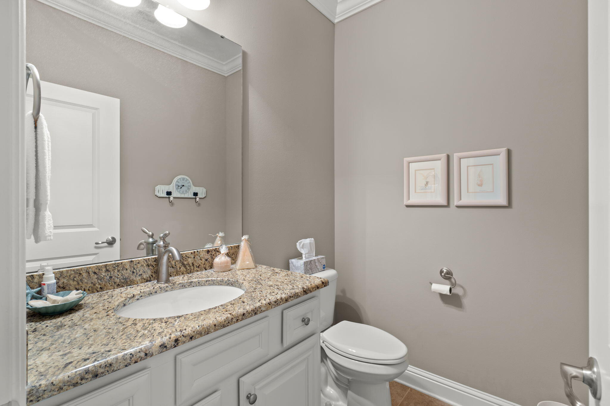 562 Falcon Trail Niceville, FL 32578 - Photo 17 of 40 a bathroom with a granite countertop sink a toilet and a mirror