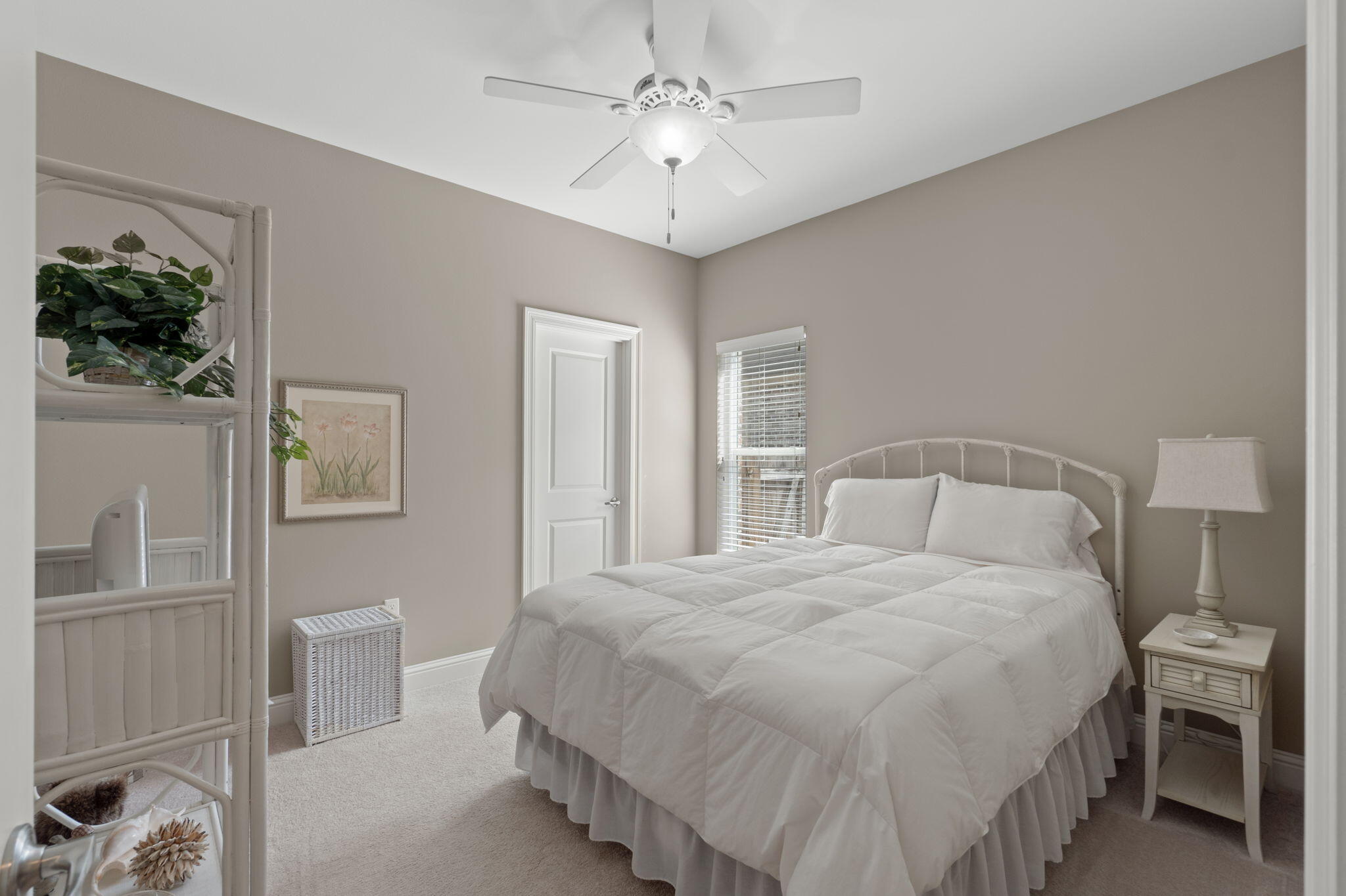 562 Falcon Trail Niceville, FL 32578 - Photo 18 of 40 a bedroom with a bed and a chandelier