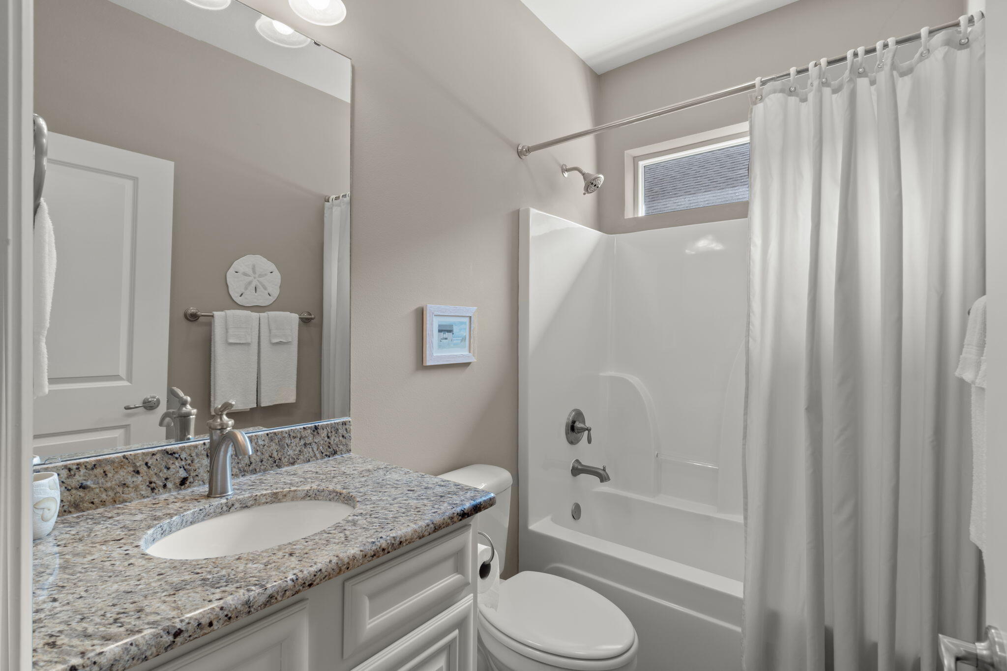 562 Falcon Trail Niceville, FL 32578 - Photo 20 of 40 a bathroom with a granite countertop sink toilet and shower