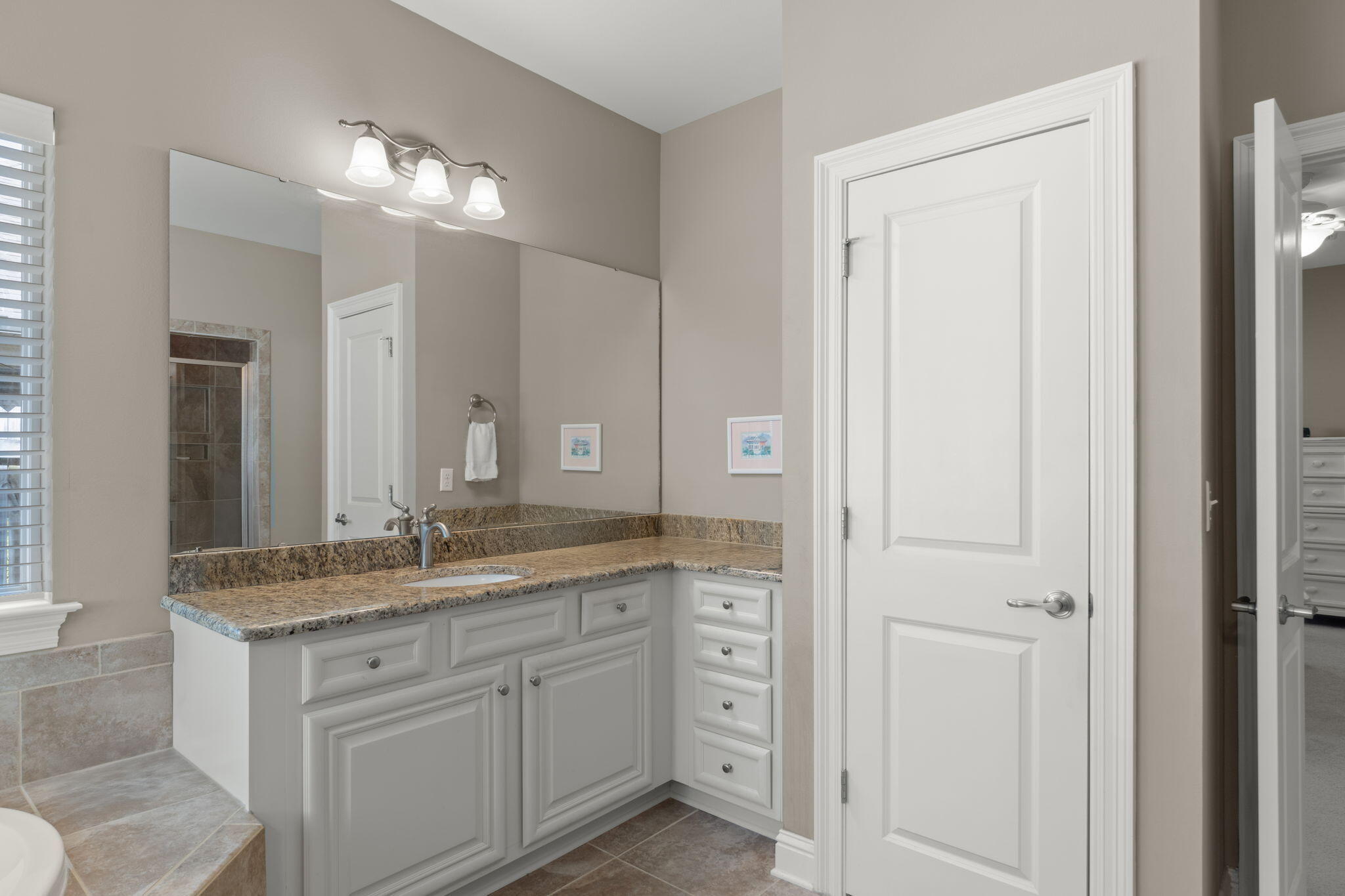 562 Falcon Trail Niceville, FL 32578 - Photo 25 of 40 a bathroom with a granite countertop sink and a mirror