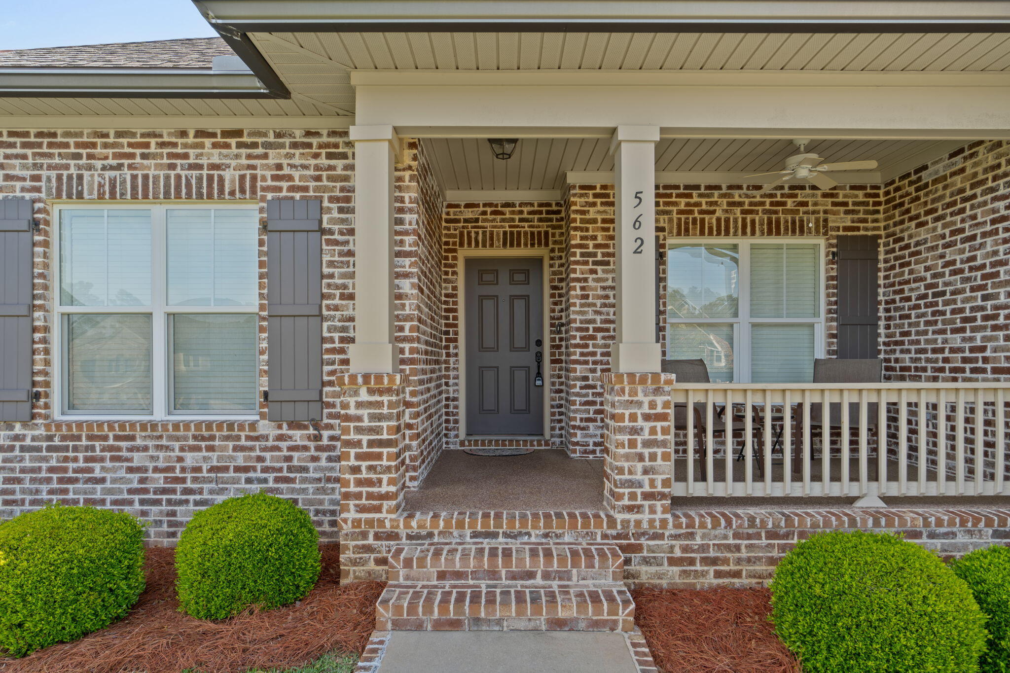 562 Falcon Trail Niceville, FL 32578 - Photo 3 of 40 a view of a brick house with a door and wooden floor