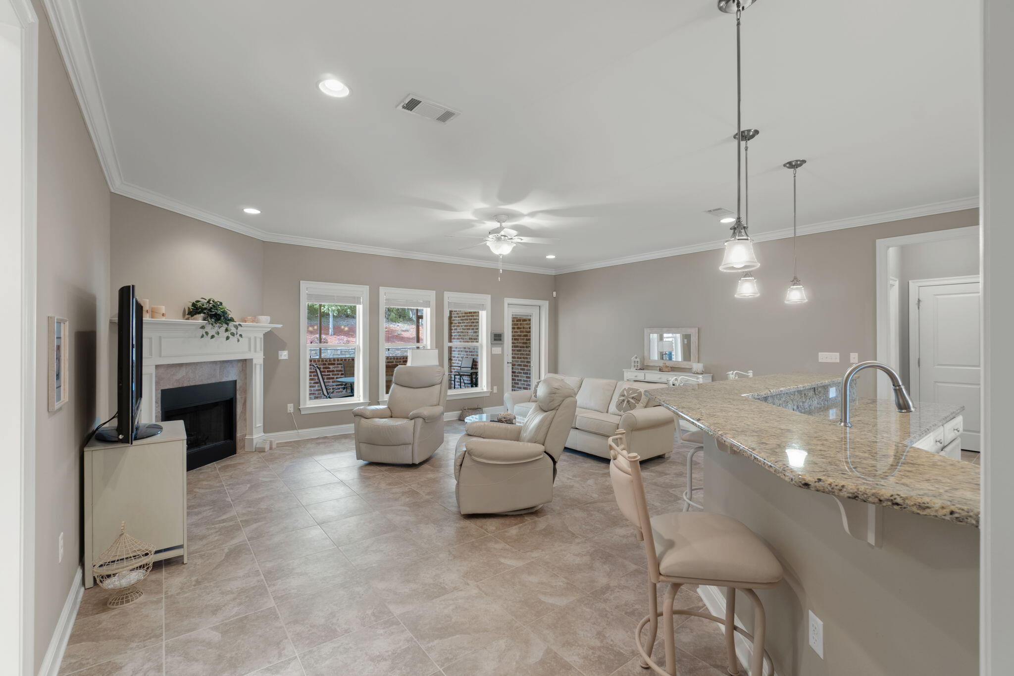 562 Falcon Trail Niceville, FL 32578 - Photo 6 of 40 a living room with fireplace furniture and a flat screen tv