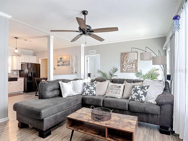 102 Ash Street Edgewater, FL 32141 - Photo 13 of 36 a living room with furniture and a ceiling fan