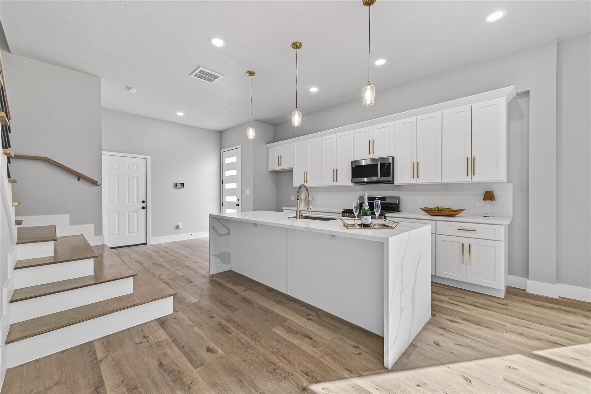4115 Yale Street Houston, TX 77018 - Photo 15 of 35 Open-concept layout with seamless flow and elevated lighting design.