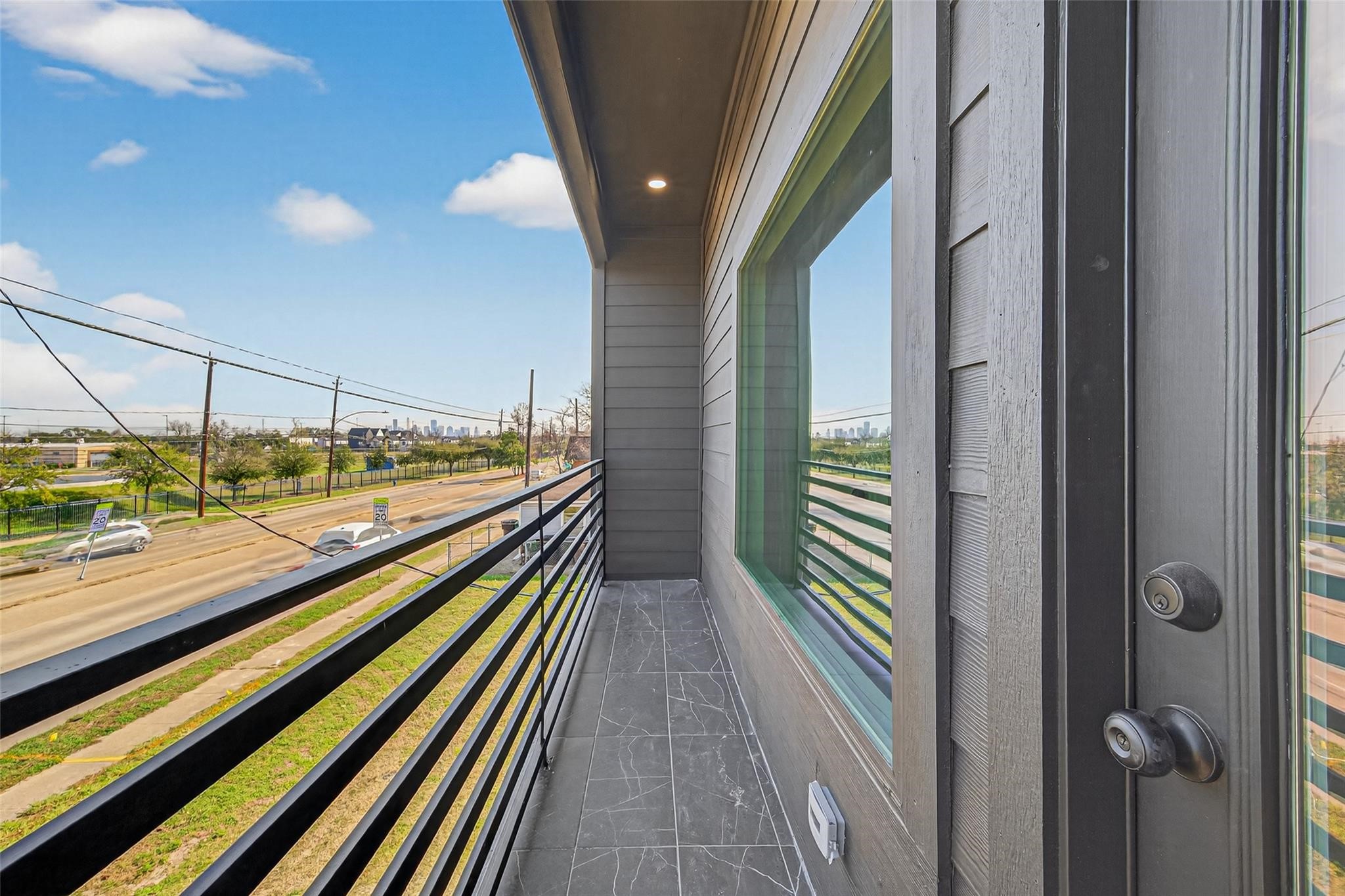4115 Yale Street Houston, TX 77018 - Photo 25 of 35 Private balcony off of front bedroom offering outdoor living space with view of Downtown.