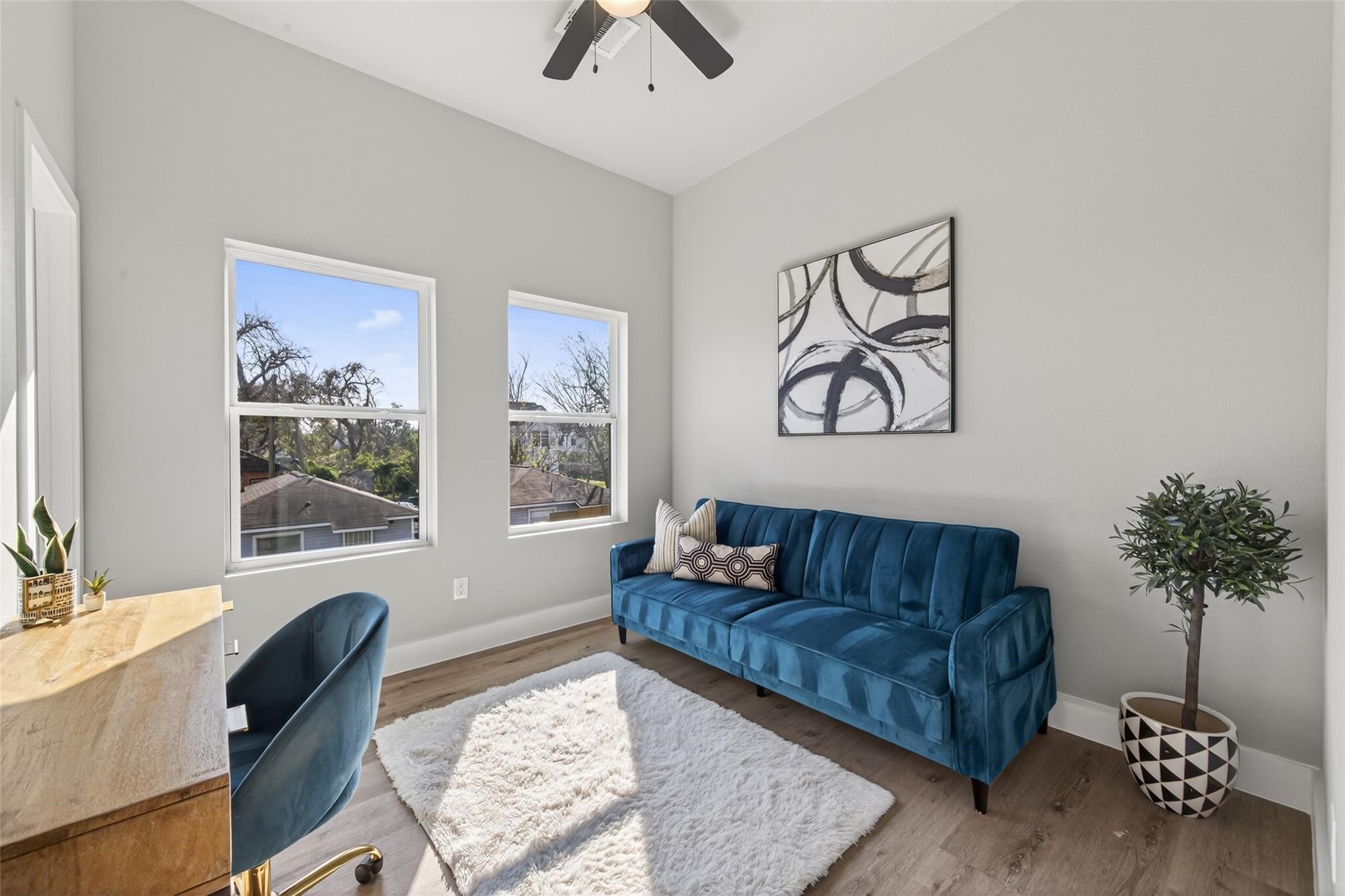 4115 Yale Street Houston, TX 77018 - Photo 26 of 35 Flexible secondary bedroom or home office with oversized windows, white oak–finish flooring, and a bright, airy layout perfect for remote work or guest accommodations.