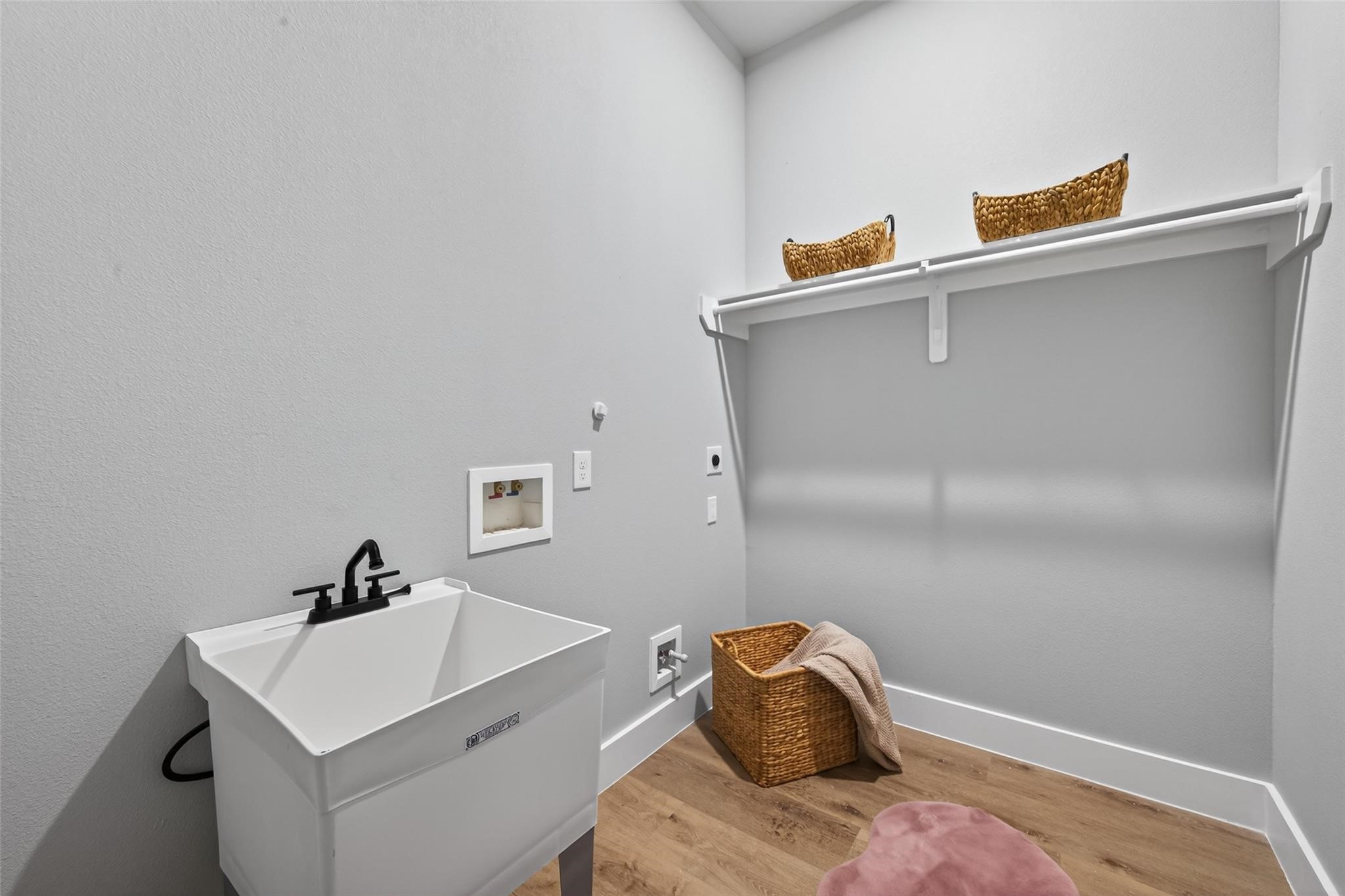 4115 Yale Street Houston, TX 77018 - Photo 29 of 35 Spacious laundry room with utility sink and built-in shelving for added convenience.