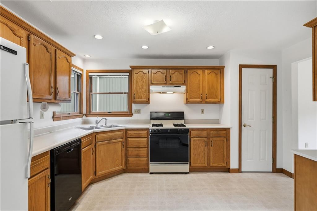114 Sika Drive Pittsburgh, PA 15239 - Photo 14 of 45 a kitchen with stainless steel appliances granite countertop a sink stove and refrigerator